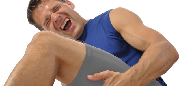 Man clasping hamstring in pain requires physiotherapy Sevenoaks for help with sports injury image